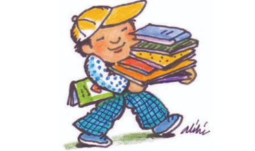 child carrying a stack of books